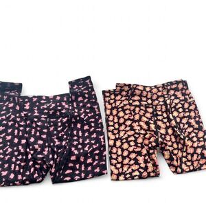 2 Pairs Betsy Johnson animal print leggings size medium EUC Black/Pink